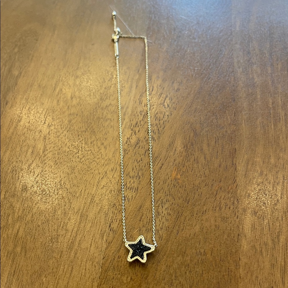 Kendra Scott pendant necklace with gold star and black drusy stone